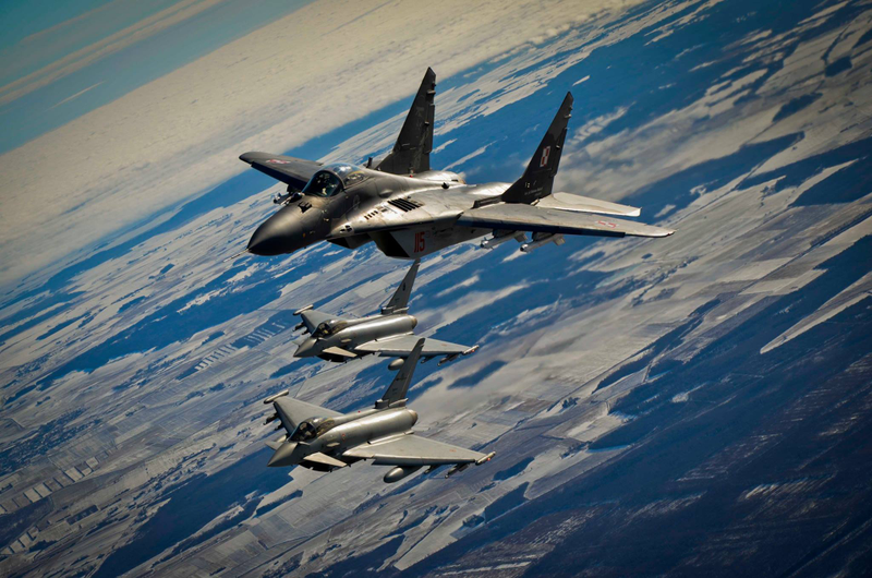 Illustration for article titled These Shots Of Fulcrums and Eurofighters Over Lithuania Are Amazing
